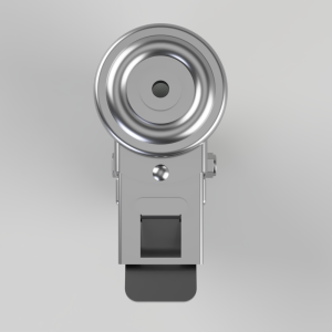 Front view of a shiny metal latch with a circular, concentric-dial top on a gray housing.