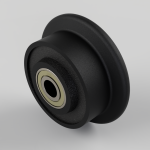 Black idler pulley with metal inner bearing, shown at an angle for a mechanical belt system