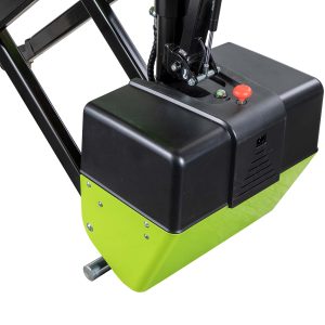 Close-up of industrial control panel on a black machine with a red emergency stop button and a green base at the bottom edge.