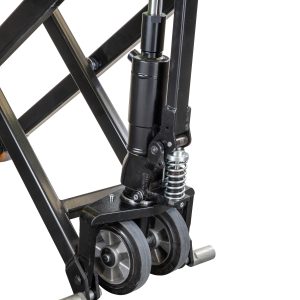 Close-up of a hydraulic cylinder and scissor lift frame with a bright yellow pivot on a metal structure.